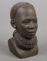 A Kenyan terracotta bust of a tribal woman, by Yuko Miyare 'pothot lady'. 21cm tall. Some very small