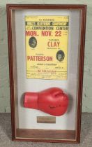 A framed boxing display. Includes promotional poster Cassius Clay vs Floyd Patterson and signed
