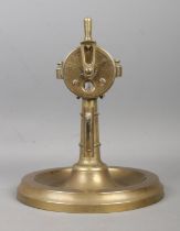 An early Twentieth century brass cigar cutter and ashtray, in the form of a ship's telegraph.