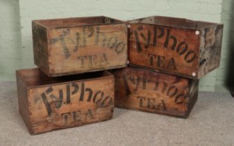 Four wooden crates stencilled for Typhoo Tea.