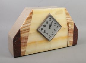 An Art Deco marble mantel clock. Having diamond shaped silvered dial and Arabic numeral markers.