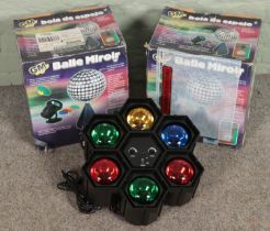 Two boxed disco balls along with a multi coloured disco light.