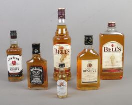 A collection of assorted whisky, including Bells, Jack Daniels and Jim Beam.