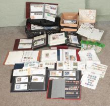 A large quantity of British stamps, presentation packs and first day covers. Mostly in albums.