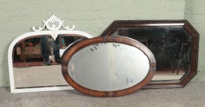 Three vintage bevel edge mirrors. Includes painted brass example and two wooden framed examples.