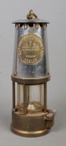 An Eccles 'Type 6' M&Q Miner's Safety Lamp; by The Protector Lamp and Lighting Co. Ltd. Oxidation to
