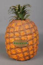 A novelty Britvic ice bucket in the form of a pineapple.