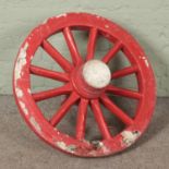 A large chunky wooden cart wheel Diameter 86cm approx