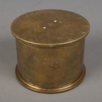 A WWI trench art shell jar and cover, composed of two 4.5 Howitzer cases dated 1916 and 1917. The