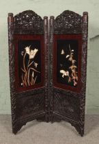 A Japanese carved and lacquered two fold dressing screen. Having Shibayama style decoration.