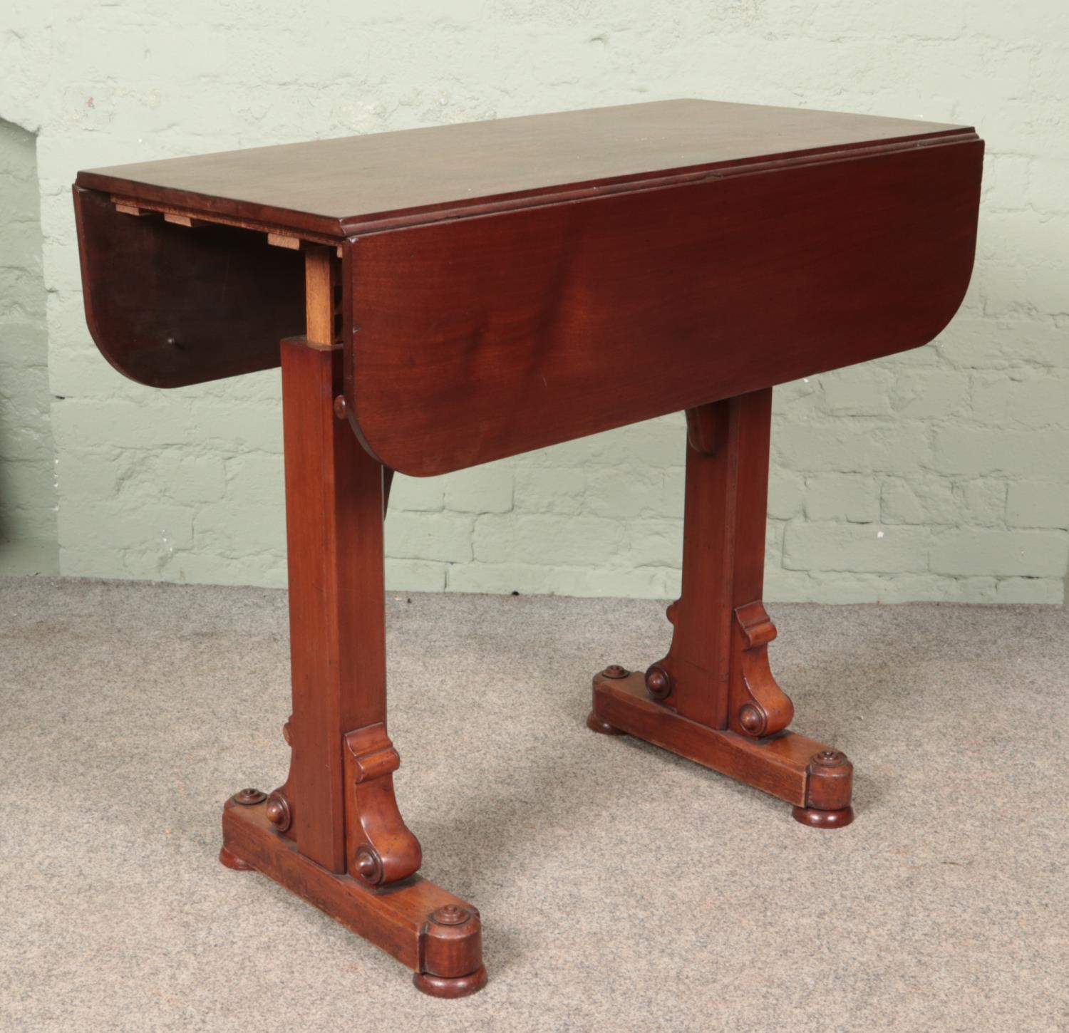 A Victorian mahogany drop leaf rise and fall buffet table.
