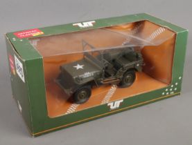 A boxed UT Models Willy's Jeep die cast 1:18 model.