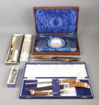 A collection of mainly boxed flatware, to include Victorian horn handled carving set and James Dixon