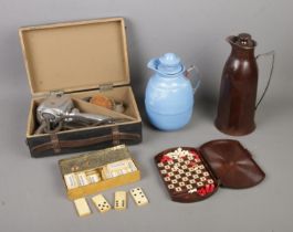 A box of assorted bakelite items to include miniature travel chess set, Woodbine Cigarettes