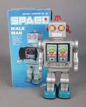 A boxed battery operated Homme Marchantade Space Walk Man.