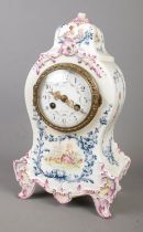 A Longwy ceramic mantle clock featuring painted decoration depicting a young girl in a field of