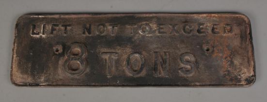 A cast iron railway sign 'Lift Not to Exceed 8 Tons'. 56cm wide.