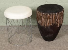 An African hide drum along with a small leather topped stool.