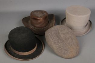 Four hats. Includes Youngs top hat, Australian Jacaru hat, bowler hat, etc.