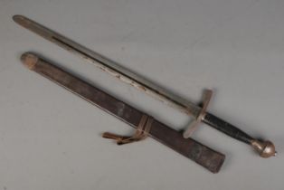 A sword with leather wrapped handle, fullered blade and leather scabbard. Length of blade (71cm)