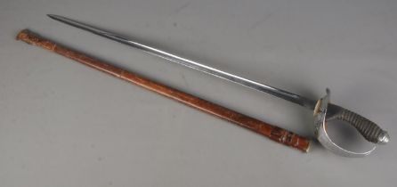 A 1912 pattern cavalry officers sword with leather scabbard. Length of blade 87cm. CANNOT POST