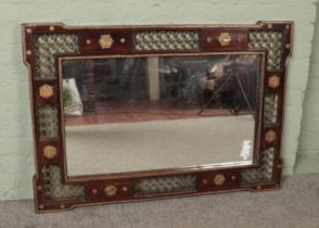 A large ornate hardwood and gilt metal mirror. 85cm x 123cm.