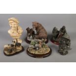 A collection of figurines including a Danbury Mint Logging at Two Acre Field, Native American