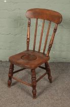 An early 20th century elm and ash child's potty chair