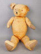 A large vintage jointed bear. Length 73cm.