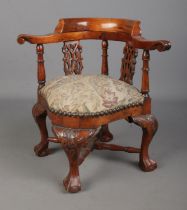 A carved miniature corner chair with upholstered seat. Hx31cm General wear, knocks to wood.
