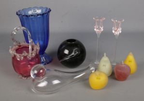 A collection of art glass, to include Caithness candlesticks, Ivy Glass fruit and Bohemia glass