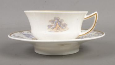 A Rockingham teacup and saucer with 'figure 7' handle. Printed, enamelled and with gilded decoration