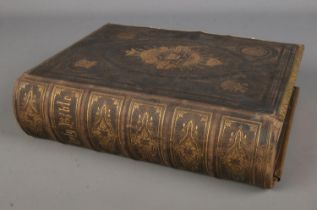A leather bound Brown's self-interpreting family bible, containing the old and new testaments.