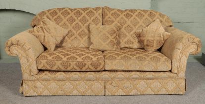 A three piece sofa suite with beige floral upholstery. Comprising of three seat sofa, two seat