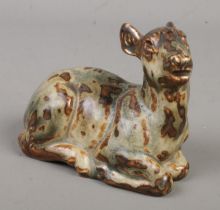 An early Royal Copenhagen stoneware figure formed as a recumbent deer. Possibly by Knud Kyhn. Having