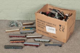 A large box of assorted model railway carriages and body shells to include Hornby, Tri-Ang, Lima,