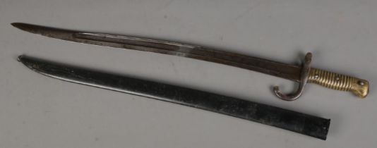An 1866 pattern French Chassepot sword bayonet with scabbard. Length of blade (57cm)
