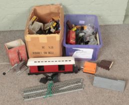 Two boxes of railway spares and repair. Includes scenery, track, large carriage body, etc.