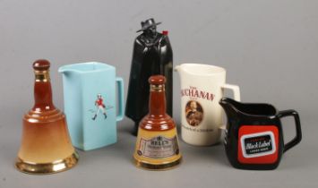 A collection of breweriana. Includes Royal Doulton Sandeman decanter, Royal Doulton and Wade Bell'