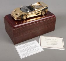 A boxed Gwilo 1/18th scale 22ct gold plated Ferrari F50 Cabriolet. With certificate.