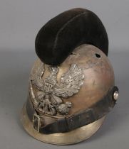 A military helmet baring eagle crest.