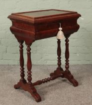 An early 20th century mahogany work box with mirrored interior. Height 70cm.