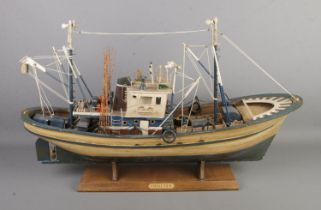 A large wooden model fishing boat "Chalutier" on stand. (52cm x 87cm)