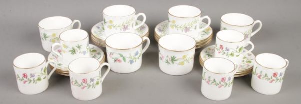 A quantity Royal Worcester cups & saucers in the Arcadia design.