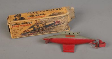 A boxed J.W Sutcliffe Unda-Wunda tin plate clockwork submarine. Missing key.