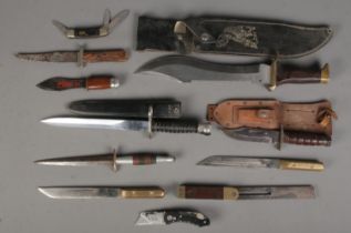 A quantity of knives. Includes bowie knife, throwing knife, pocket knife, etc. CANNOT POST OVERSEAS.