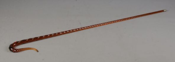 A Victorian amber coloured glass barley twist cane, with swan neck.