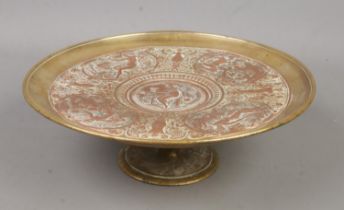 A late 19th century brass and copper tazza. With central panel depicting Temperantia, surrounded