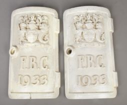 A pair of cast iron street light door plates, both dated 1933 and with initials F.B.C, for