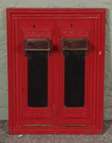 A cast iron postage stamp vending machine front. Height: 51cm, Width: 38cm.